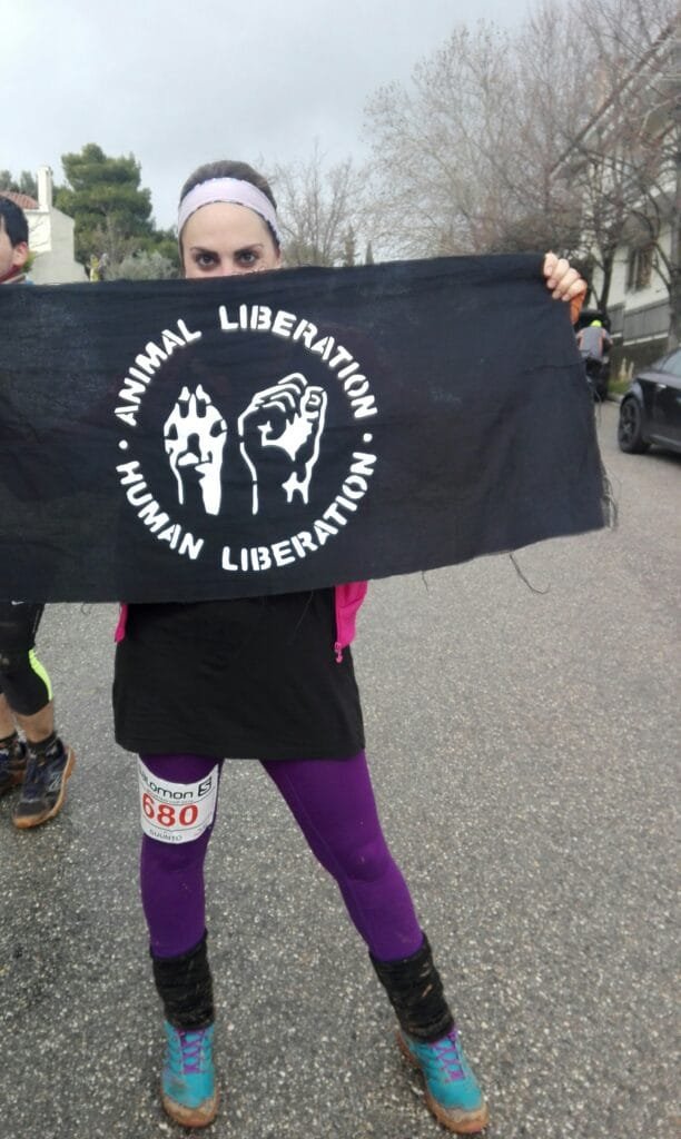 Elisabeth Dimitras holding Animal Welfare flag
