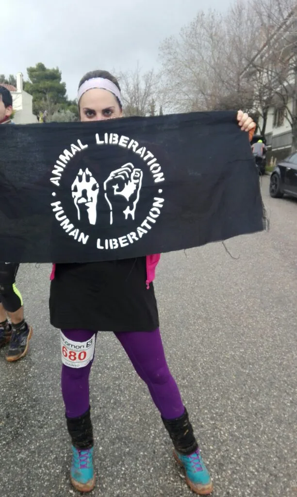 Elisabeth Dimitras holding Animal Welfare flag
